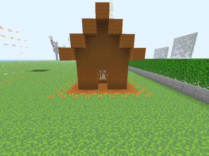 Screenshot of a house made from orange blocks, with a minecraft girl dressed in orange inside.